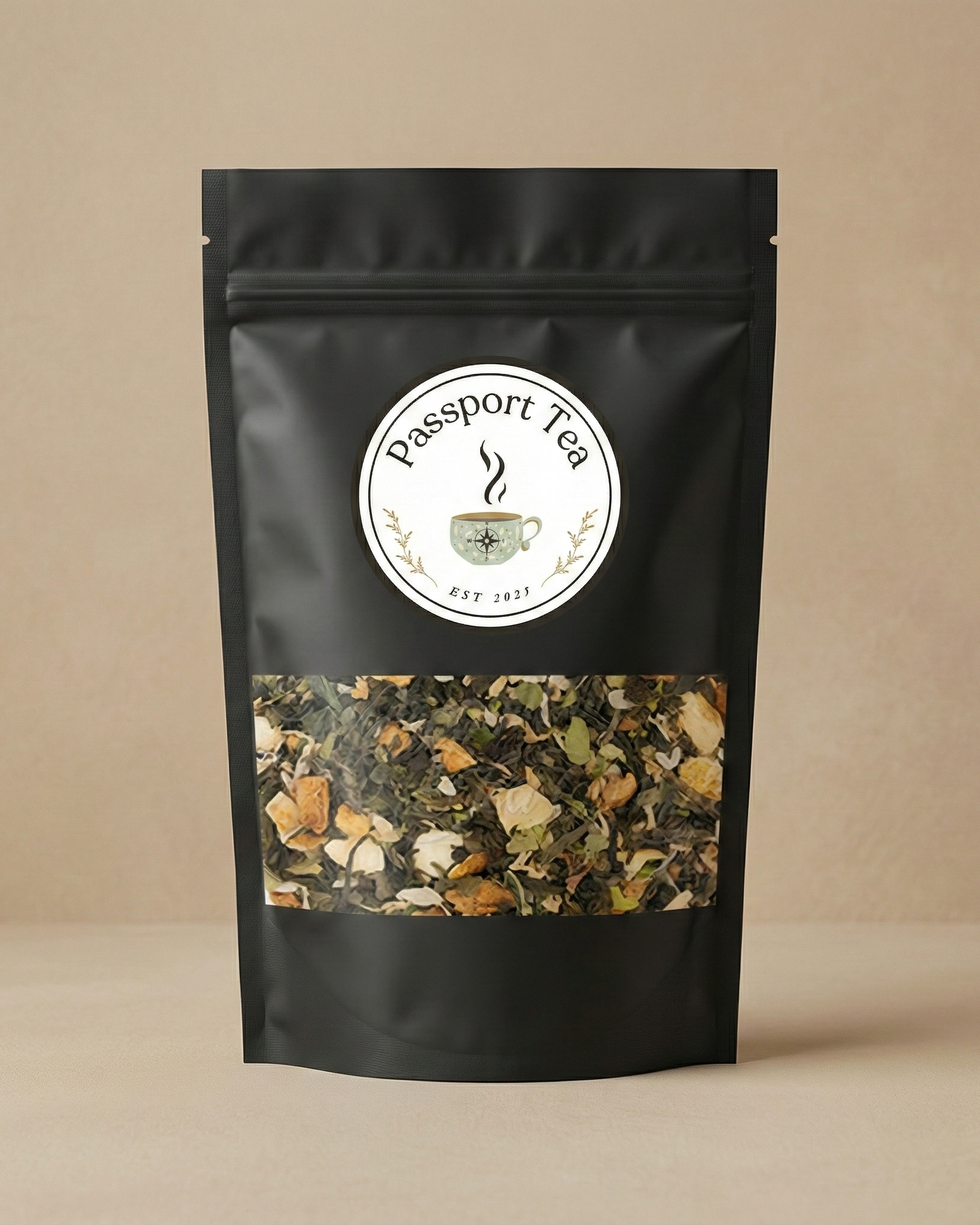 Black tea packaging with 'Passport Tea' label on a beige background