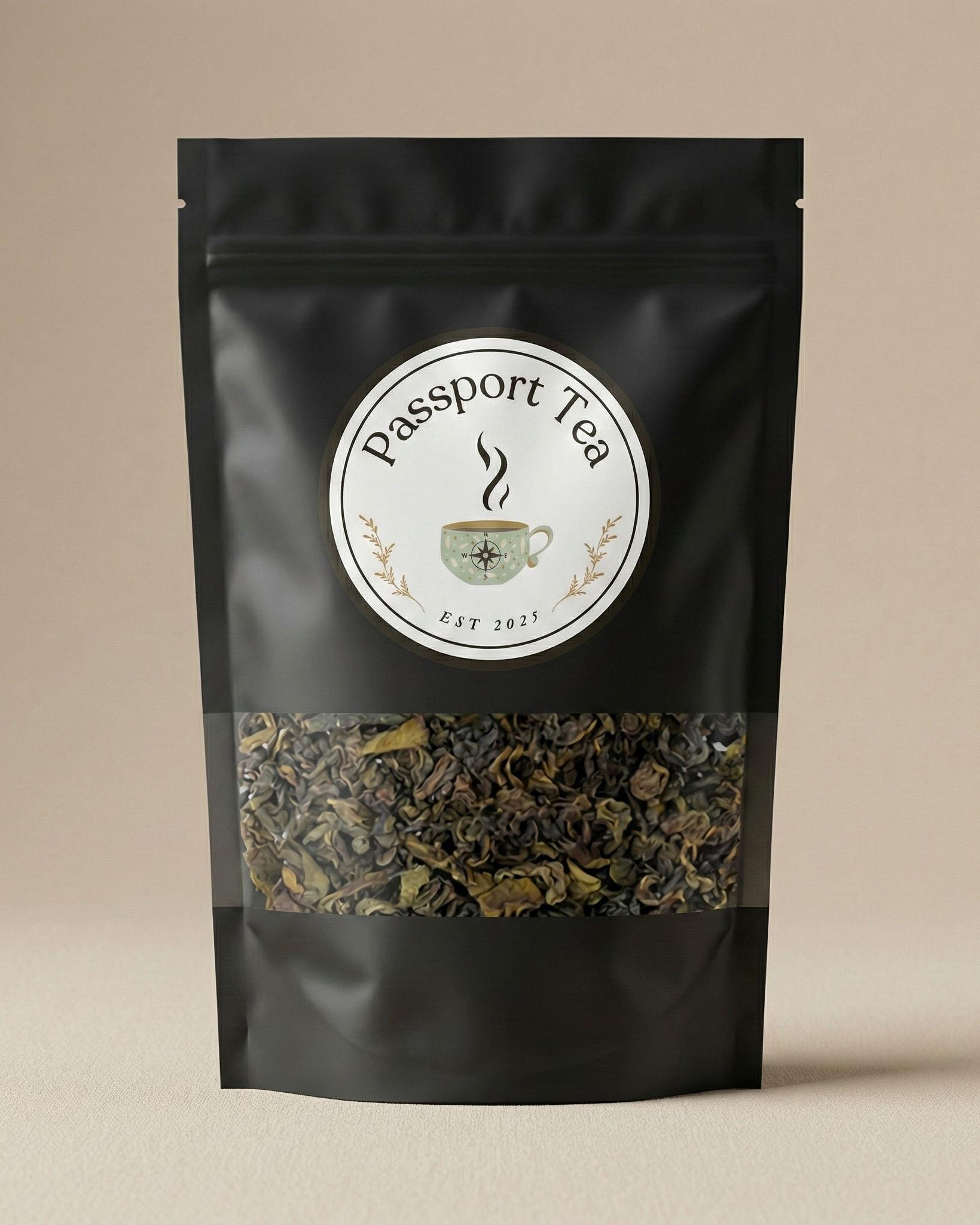 Black tea package with 'Passport Tea' label on a beige background