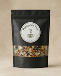 Black tea packaging with 'Passport Tea' label on a beige background